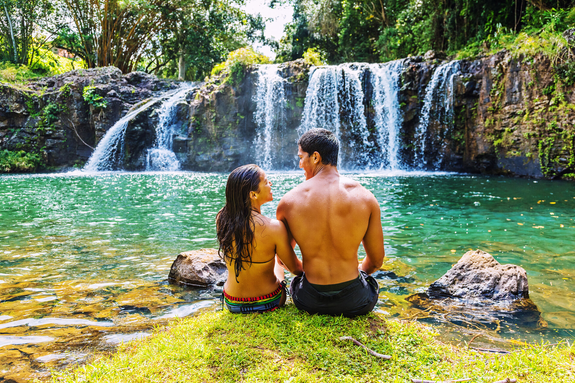 Couple sitting in a natural pool of water